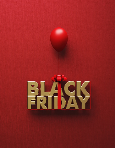 Gold colored Black Friday word tied with red ribbon is about to be carried away by red balloon on red background. Vertical composition with copy space, Great use for Black Friday concepts.