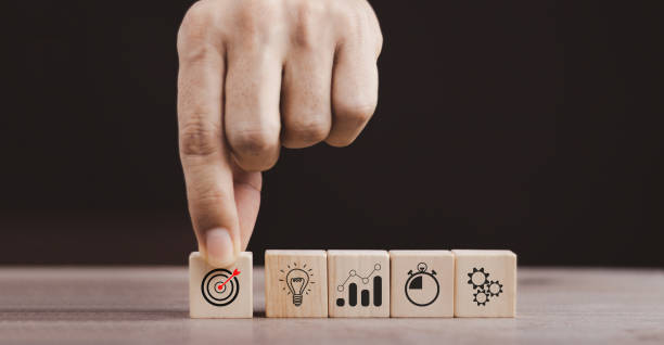 istock business strategy, Action plan, Goal and target, hand stack woods block step on table with icon about business strategy and Action plan. business development concept. copy space. 1432231763