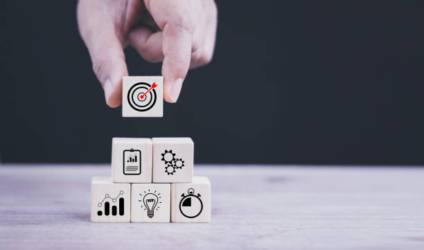 istock business strategy, Action plan, Goal and target, hand stack woods block step on table with icon about business strategy and Action plan. business development concept. copy space. 1432231774
