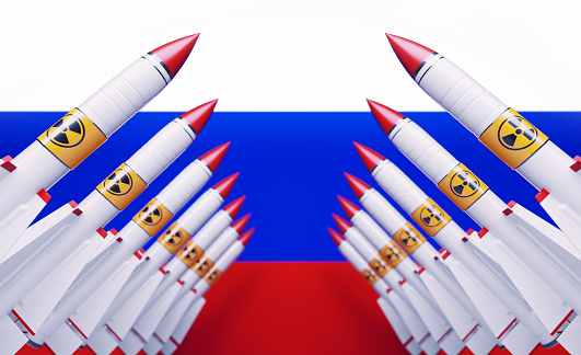 Nuclear missiles before Russian flag. Horizontal composition with copy space.  Nuclear war concept.