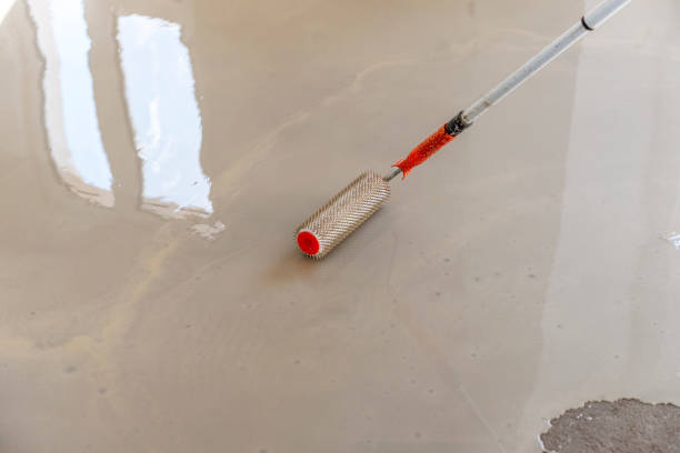 istock Self-leveling epoxy. Leveling with a mixture of cement floors. 1432237994
