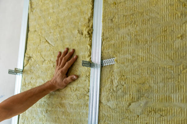 istock Worker insulating a room wall with mineral rock wool thermal insulation. 1432240616