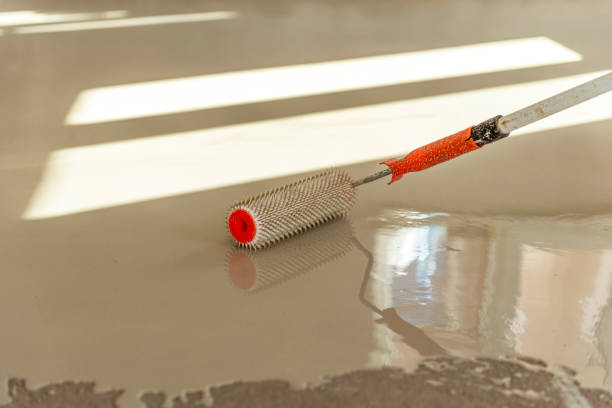 istock Self-leveling epoxy. Leveling with a mixture of cement floors. 1432242175
