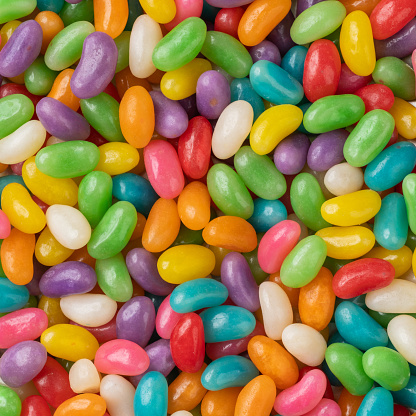 Closeup top view of colorful jelly beans. Candy backdrop.