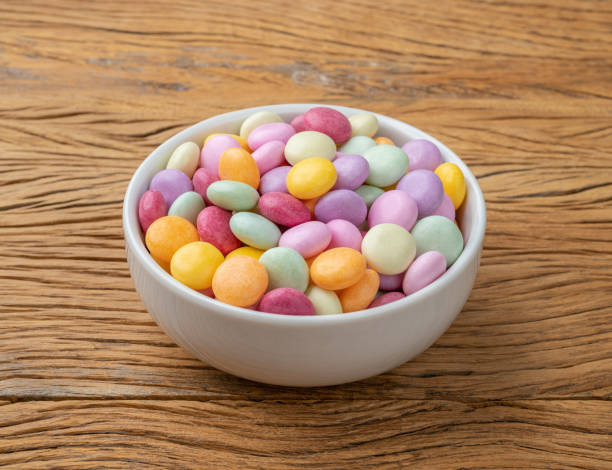 istock Colorful candies in a bowl over wooden table 1432244847