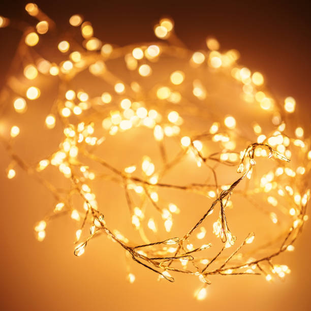 istock Christmas golden lights Background. Abstract twinkled bright bokeh defocused lights 1432249077