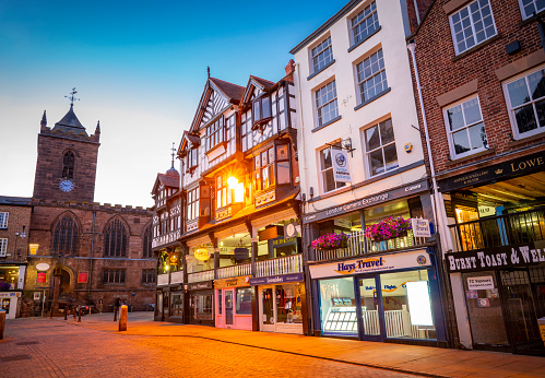 Chester Bridge Street and Chester Cross at sunset in England UK United Kingdom