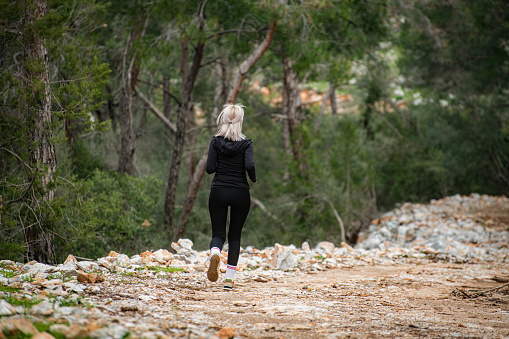 Woman Jogging in the Forest