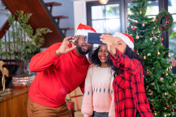 istock Family decoration gift box in background on festive christmas tree 1432253787