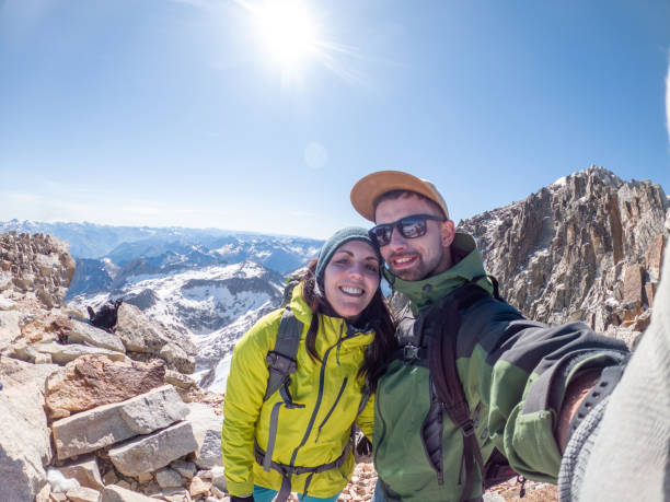 istock Mountaineers taking selfie on mountain peak 1432253983