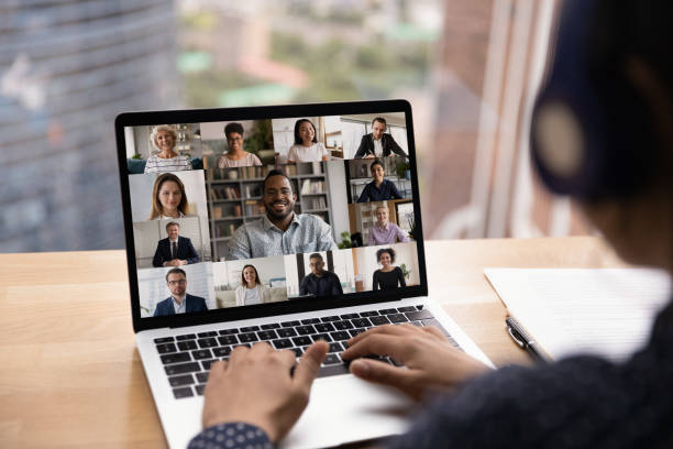 istock Female in headset take part in video conference using laptop 1432253985