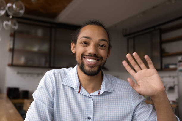 istock Smiling black man blogger start recording content say hello 1432254002
