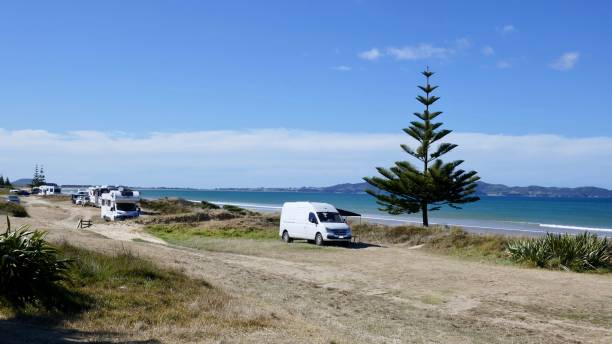 Beach motorhome freedom camping beside the sea, North Island, New Zealand