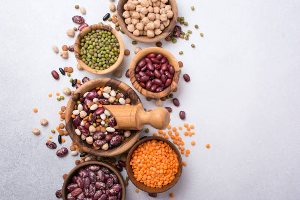 istock Different beans, lentils, mung, chickpeas in wooden bowls 1432267803