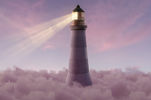 3D rendering of an illuminated lighthouse over fluffy pink clouds
