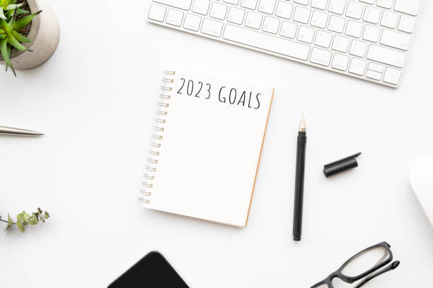 istock Notebook with 2023 goals text on it to apply new year resolutions and plan. 1432272078