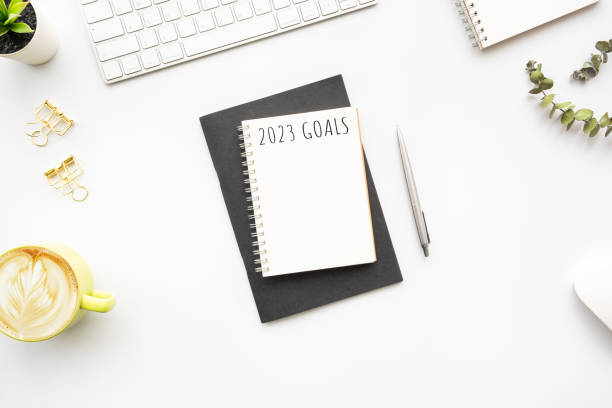 istock Notebook with 2023 goals text on it to apply new year resolutions and plan. 1432272090