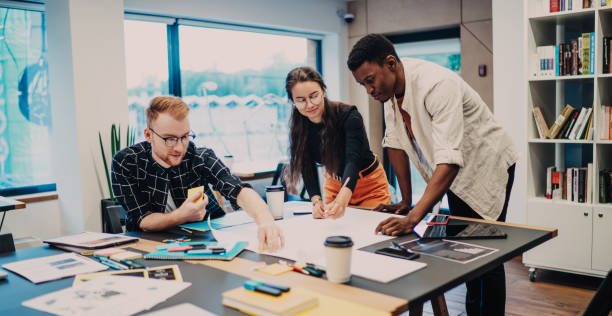 istock Young colleagues making drawings in office 1432273107