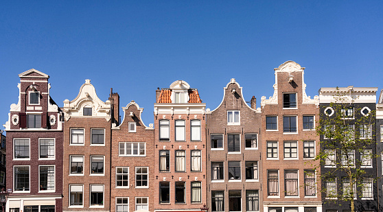 Detail of a series of tradtional terraced Dutch canal houses in central Amsterdam, Netherlands.