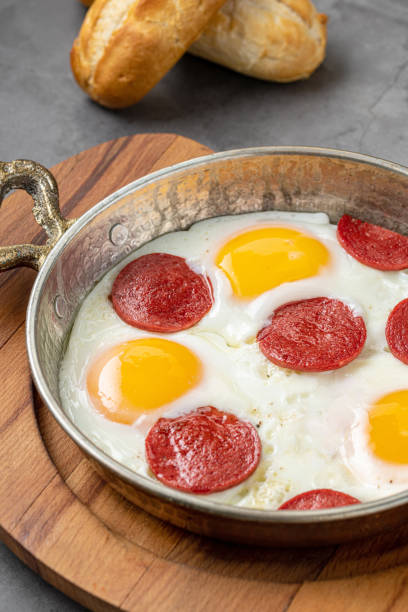 istock fried eggs with turkish sausage with bread and tea on dark stone table 1432274954