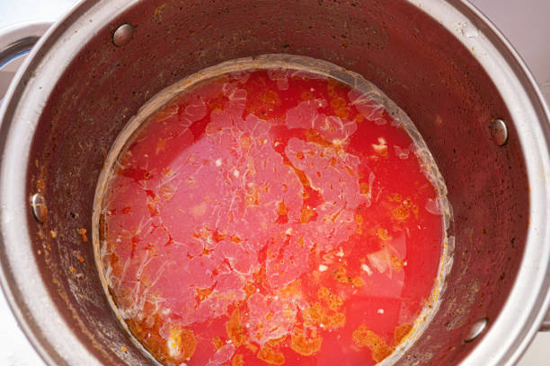 Spoiled tomato soup or borscht with mold and fungus. Spoiled borscht, concept. ugly soup stock pictures, royalty-free photos & images