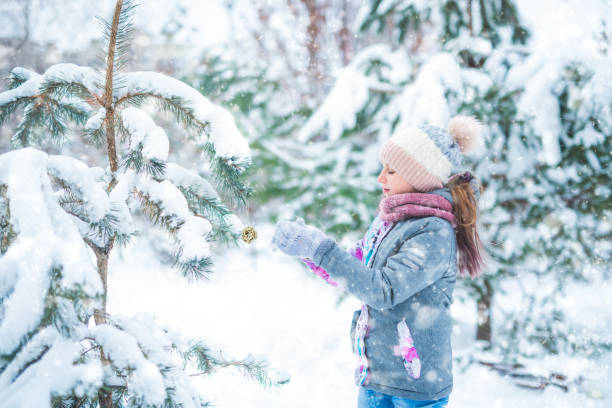 istock Little girl decorating christmas tree 1432275188