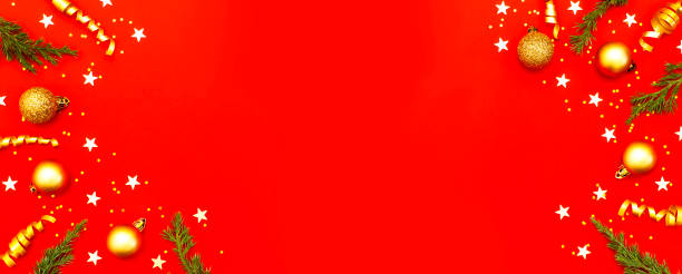 istock New Year Christmas composition. Frame from holiday decorations Christmas balls fir branches confetti snowflakes on red background. Flat lay top view copy space. Winter New Year 2020 Xmas celebration 1432276203