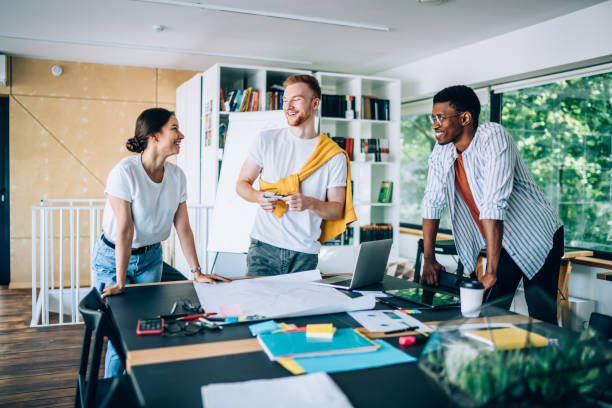 istock Excited worker drawing model of draft with partners 1432277188