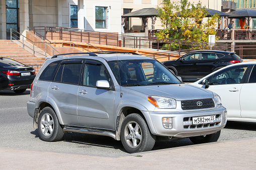 Atyrau, Kazakhstan - October 4, 2022: Grey crossover Toyota RAV4 in the city street.