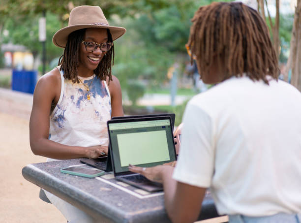 istock When you bring your work and your twin sister for an outdoor remote  session 1432278833