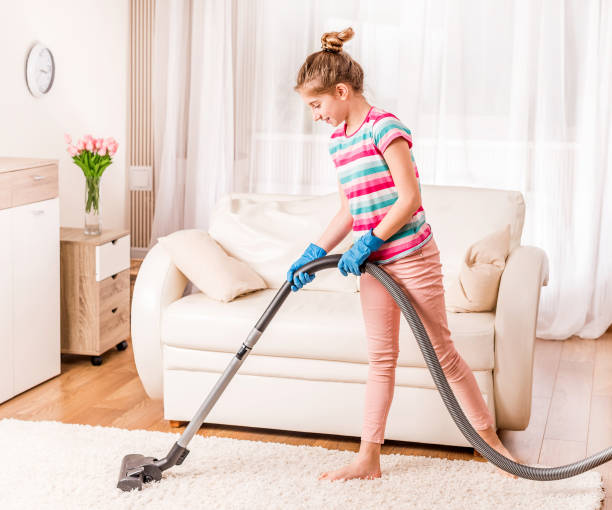istock Girl is cleaning carpet 1432278869