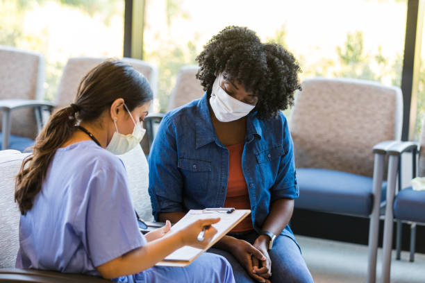 istock Female doctor documents patient symptoms on medical record 1432280849