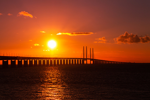 Beautiful sunset over the bridge Oresund connecting Copenhagen (Denmark) and Malmo (Sweden)