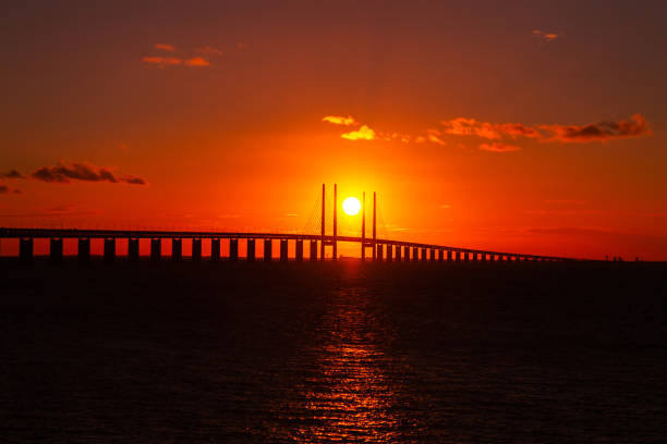 Beautiful sunset over the bridge Oresund connecting Copenhagen (Denmark) and Malmo (Sweden)