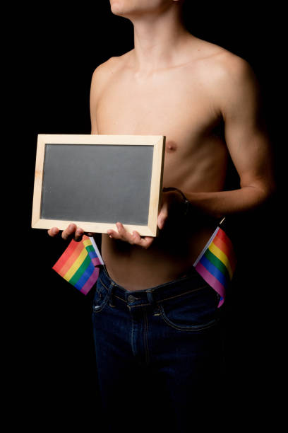 istock A Shirtless 19 Year Old Teenage Boy with Pride Flags 1432286054