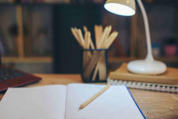 istock Planner write meeting agenda at Calendar book, work online at home. Diary for organizer to plan timetable, daily appointment, and management job at office desk. Planner book and Calendar 2023 Concept. 1432286870