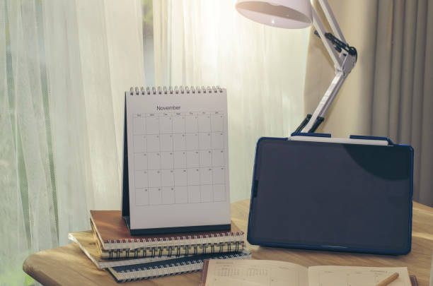 istock Business executive home office Desk Background concept. Business tablet empty home office table with desktop calendar, phone, notebook, book, appiontment agenda, lamp and pencil. 1432286887