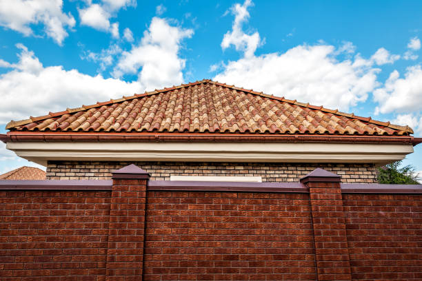 Ceramic roof tile triangle and brick fence under blue sky