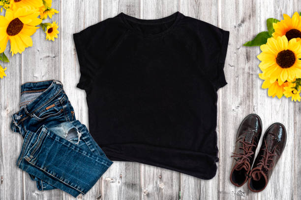 istock Black t-shirt rustic mockup on wood background 1432292906