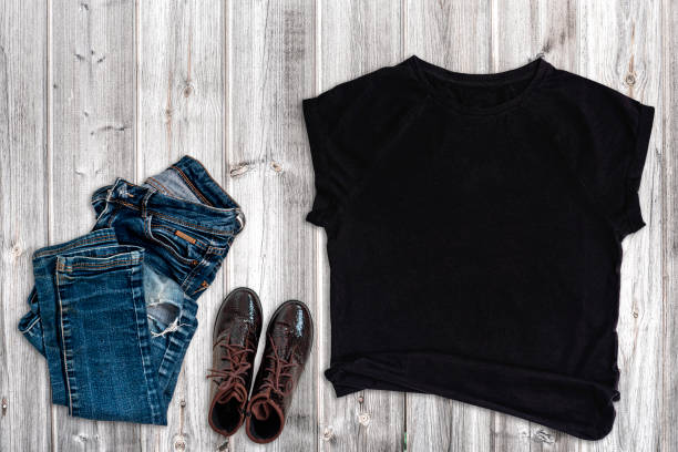 istock Blank Black t-shirt Mockup on gray wood background. 1432292915