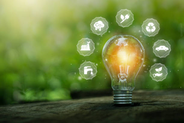 istock Green energy concept.Environmental protection, renewable, sustainable energy sources.Light bulb with icon and green background. 1432295494