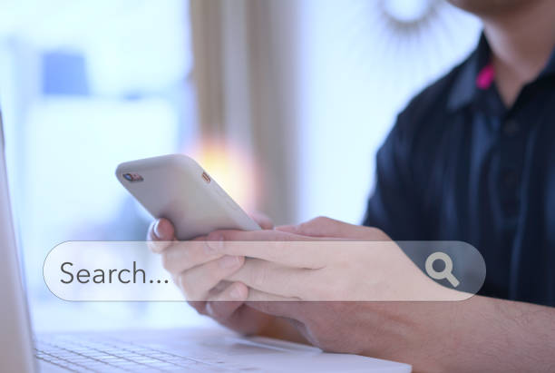 istock man find information from internet via laptop on table 1432297522