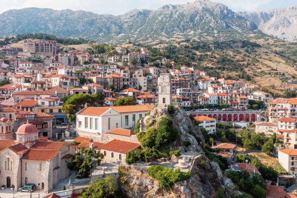 Arachova Greece mountain town aerial drone view, Boeotia. Tourist resort Arachova Greece, Traditional mountain town aerial drone view. Tiled roof houses and stone tower clock, tourist resort in Boeotia. arachova greece stock pictures, royalty-free photos & images