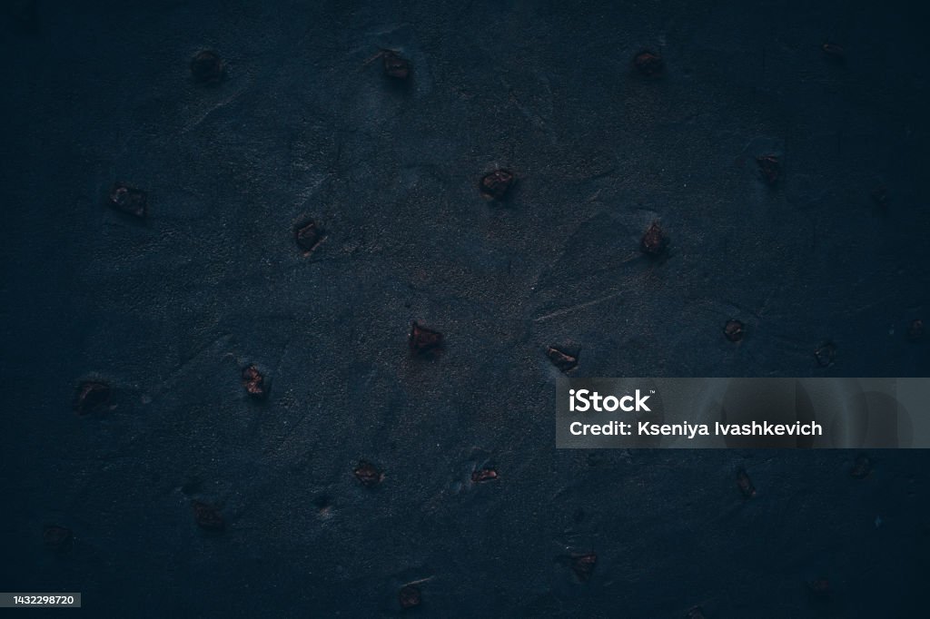 Rock texture. Dark stone wall. Stone background. Rock surface with holography, nacre. Wall abstraction. Paint spots. Rock surface with cracks. Abstract texture. Abstract Stock Photo