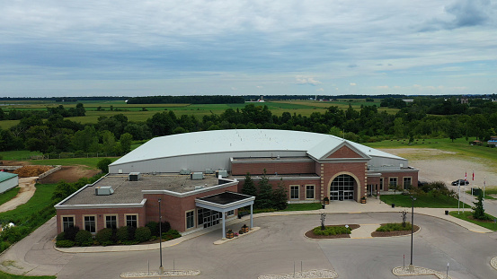 Sydney, Canada - July 28, 2023: The Canada Games Complex was built at Cape Breton University to host the 1987 Canada Winter Games, and was decommissioned in 2016. In 2022 Sydney won the Kraft Hockeyville competition and will receive $250,000, $10,000 worth of youth hockey equipment and gets to host an NHL preseason game in the fall. The newly renovated arena will provide a permanent home to the 20 girls teams in the Cape Breton Blizzard Female Hockey Association.