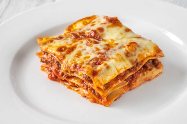 istock Portion of lasagne on white plate 1432300406