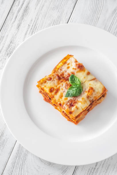 istock Portion of lasagne on white plate 1432300486