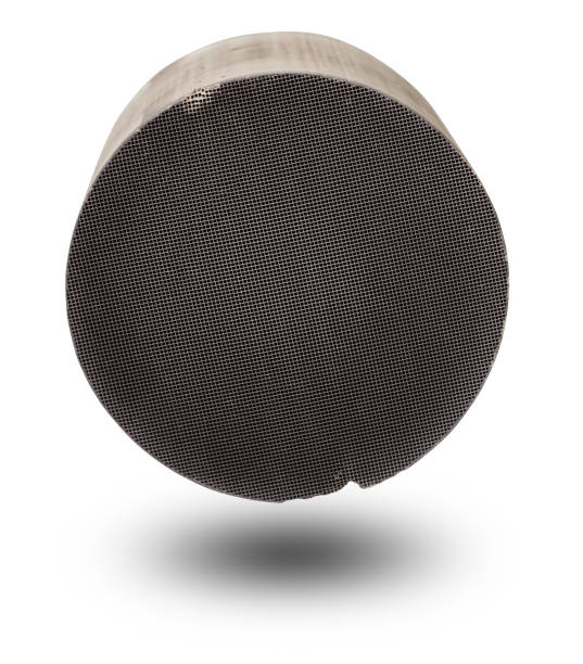 istock Processing and acceptance of non-ferrous metals. One round and oval ceramic catalysts containing platinum, palladium and rhodium on a white background. 1432302224