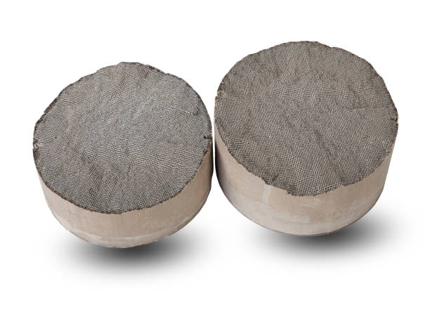 istock Processing and acceptance of non-ferrous metals. Two round and oval ceramic catalysts containing platinum, palladium and rhodium on a white background. 1432302311