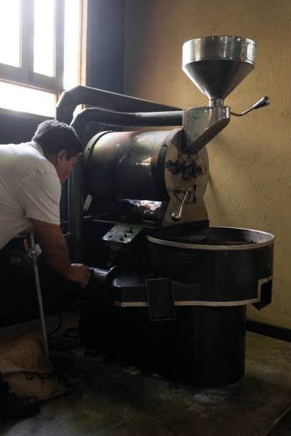 istock An Hispanic man is checking the burner of a coffee roaster machine 1432302382